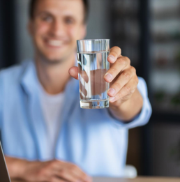 Man Raising a Glass of Water Man Raising a Glass of Water