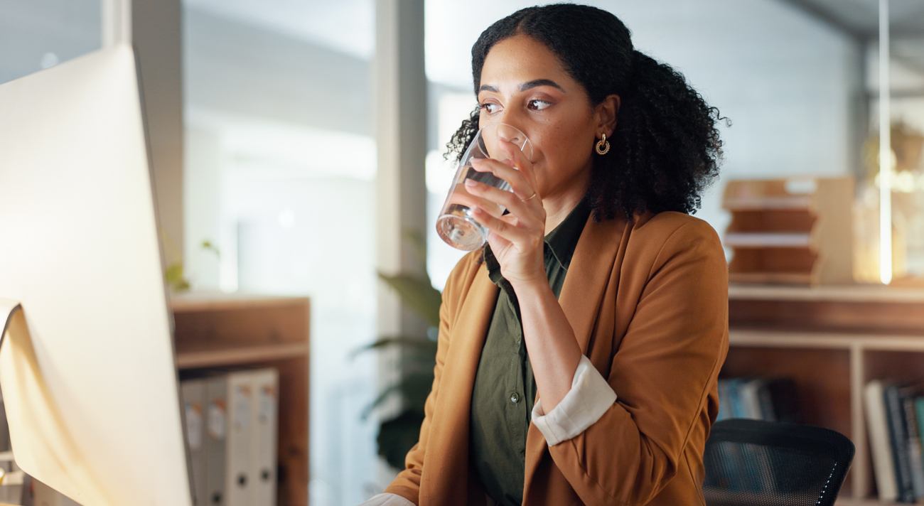 Woman Drinking Glass of Water at Work Woman Drinking Glass of Water at Work